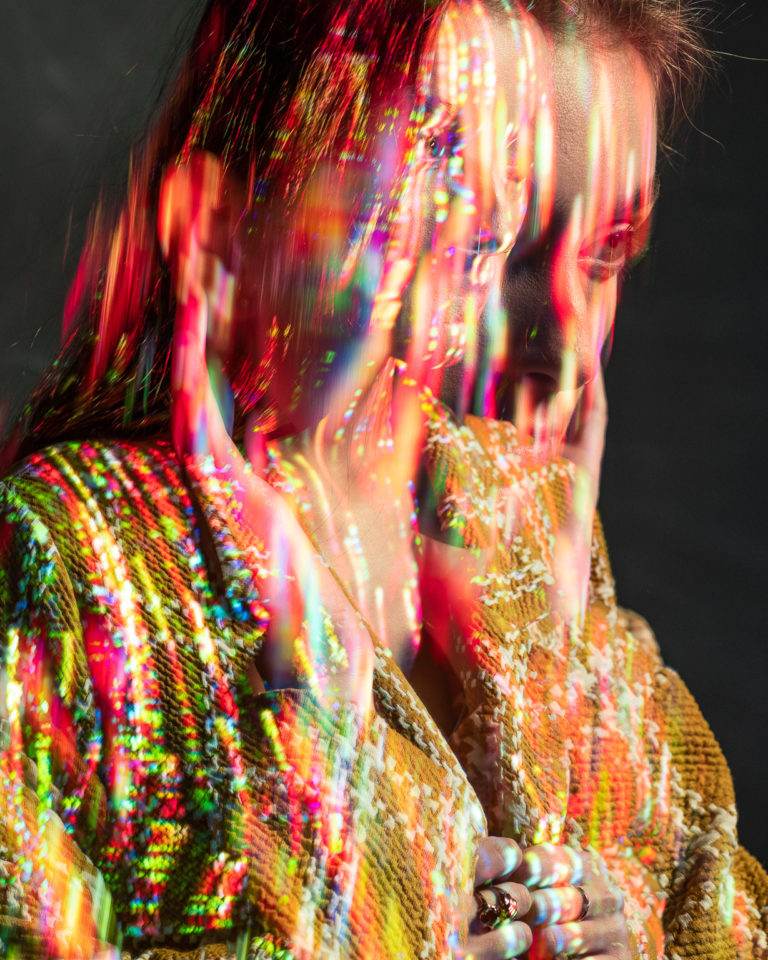 Creative portrait with color projection on face